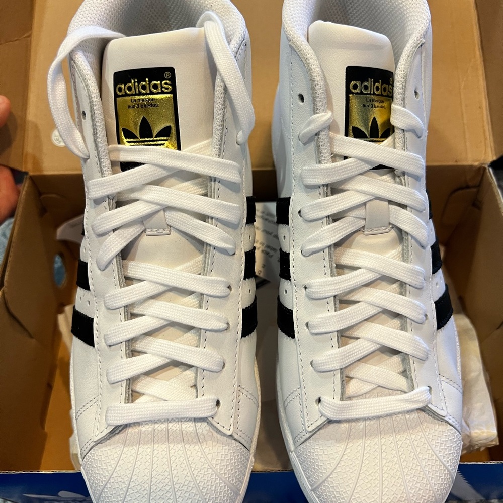 Adidas white/black stripes superstar high top sneaker, fits like a size 7